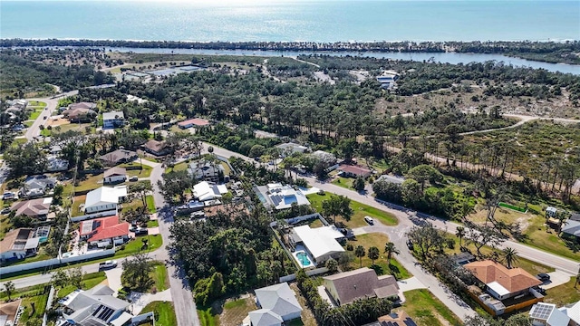 bird's eye view featuring a residential view and a water view