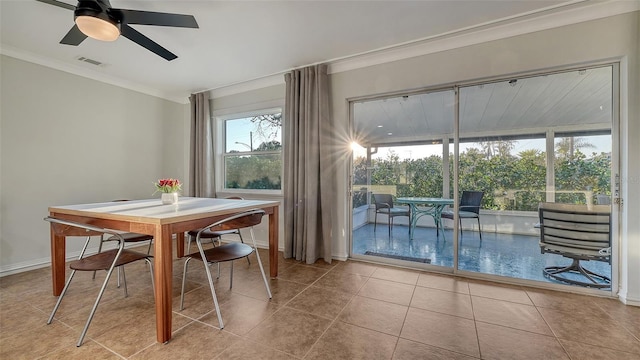 dining area featuring visible vents, baseboards, ceiling fan, ornamental molding, and tile patterned flooring