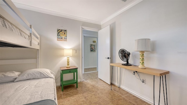 tiled bedroom with baseboards and crown molding