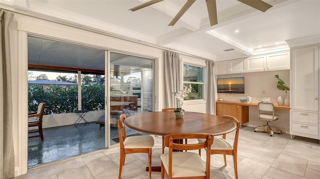 dining area with light tile patterned floors, ceiling fan, coffered ceiling, built in desk, and beamed ceiling