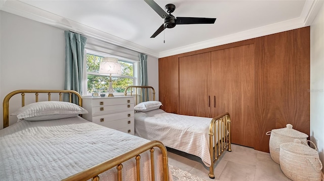 bedroom featuring light tile patterned floors, a ceiling fan, and crown molding