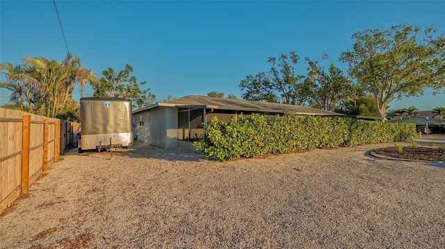 back of house with fence and stucco siding