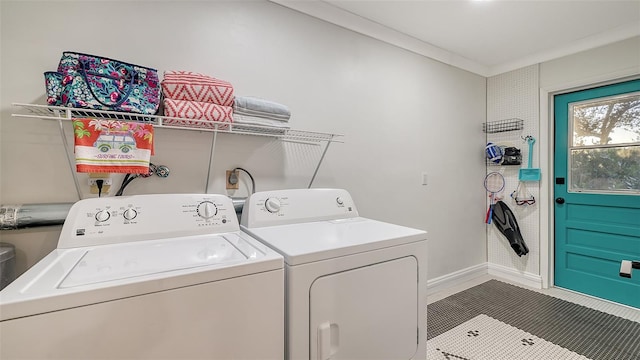 laundry room with laundry area, baseboards, ornamental molding, tile patterned flooring, and washing machine and dryer