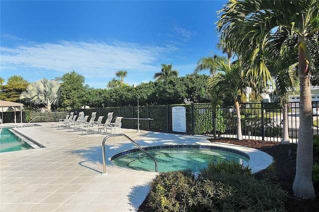 3540 Mistletoe Ln, Longboat Key, FL 34228 - community pool featuring a hot tub and a patio area
