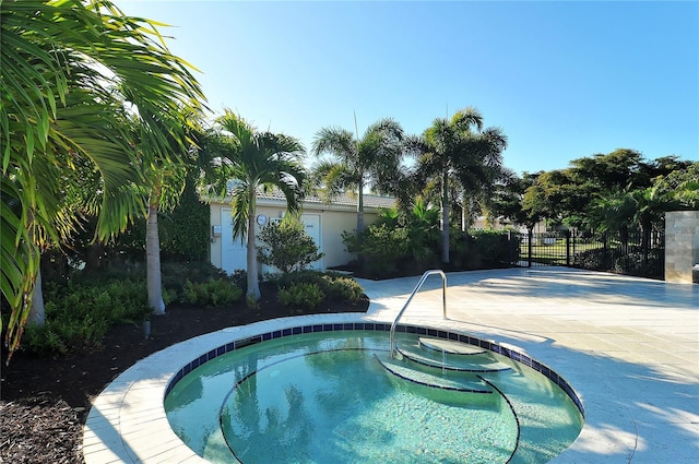 3540 Mistletoe Ln, Longboat Key, FL 34228 - view of pool with an in-ground hot tub and a patio area