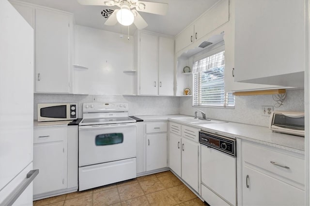 kitchen featuring open shelves, white appliances, and white cabinets