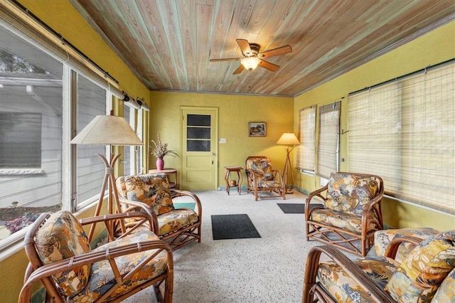 sunroom with a healthy amount of sunlight, wood ceiling, and a ceiling fan