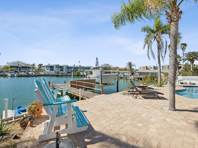 view of dock featuring a water view, an outdoor pool, and boat lift