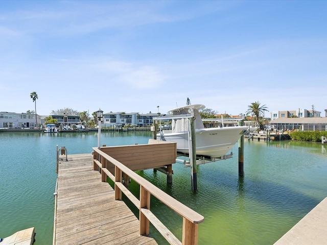 view of dock with a water view and boat lift