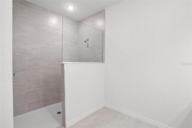 full bath featuring a walk in shower, recessed lighting, and baseboards