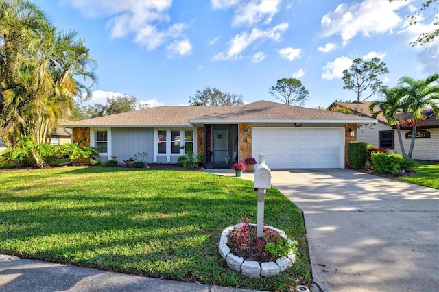 single story home featuring a garage, concrete driveway, and a front lawn