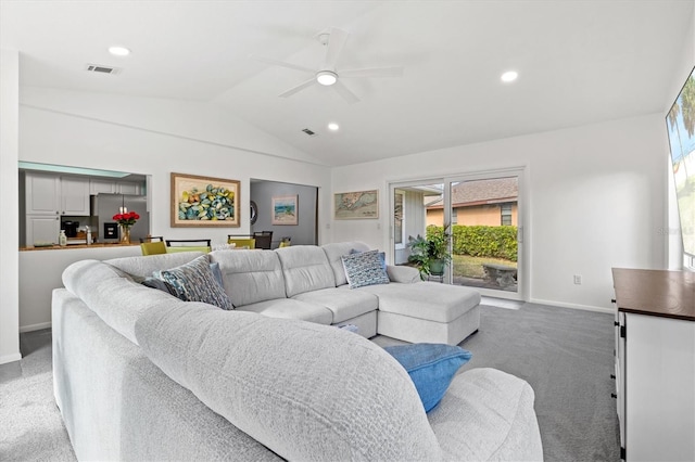 carpeted living area with lofted ceiling, baseboards, visible vents, and recessed lighting