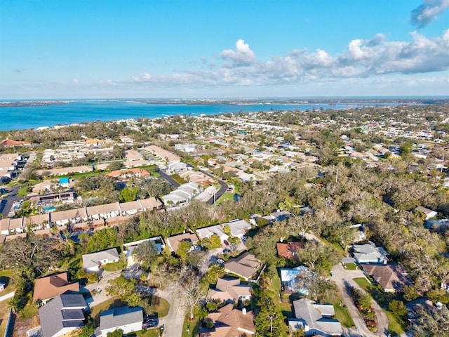 bird's eye view featuring a water view and a residential view