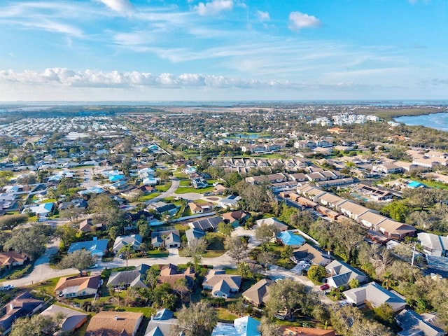 bird's eye view with a water view and a residential view