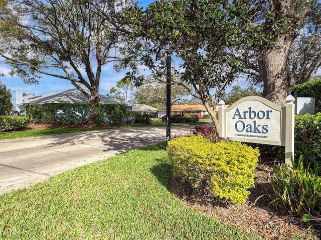 community / neighborhood sign with driveway