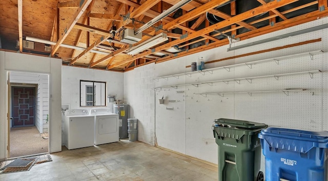 below grade area featuring water heater and washing machine and dryer