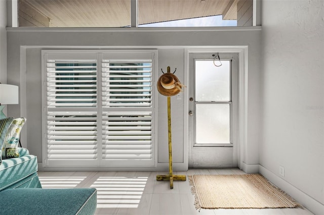 entryway featuring light tile patterned floors