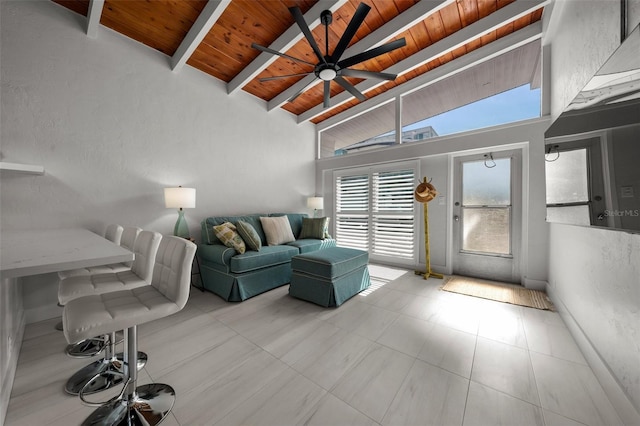 living room with ceiling fan, high vaulted ceiling, beamed ceiling, and wood ceiling