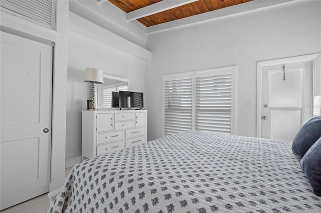 bedroom featuring beamed ceiling and wooden ceiling