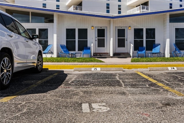 uncovered parking lot with entry steps