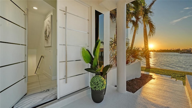 balcony featuring a water view