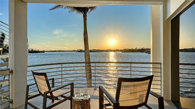 balcony at dusk with a water view