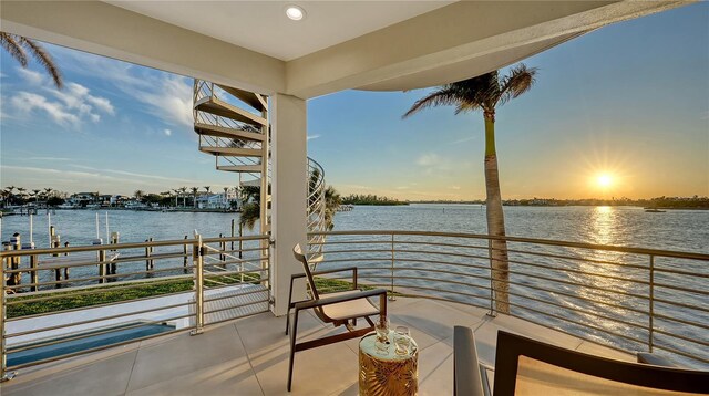 balcony at dusk with a water view