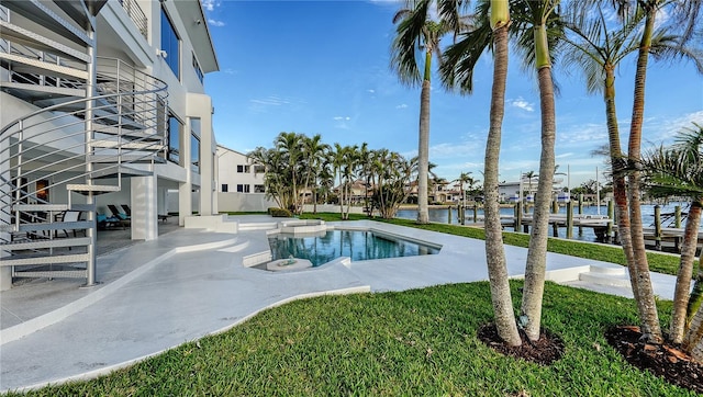 view of pool featuring a water view