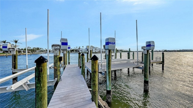 view of dock featuring a water view and boat lift