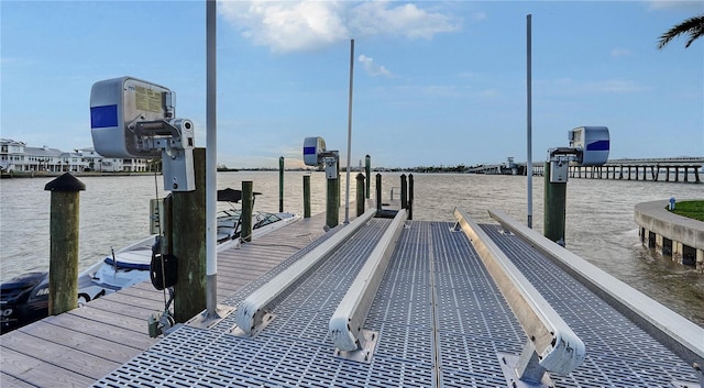 view of dock featuring a water view and boat lift