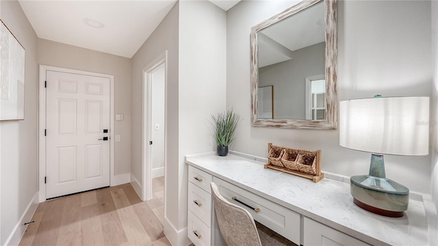 interior space with light wood-type flooring and baseboards