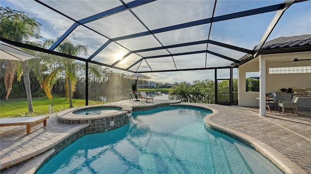 view of swimming pool with a patio area, a lanai, and a pool with connected hot tub