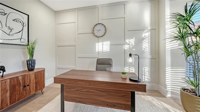 home office featuring light wood-style flooring