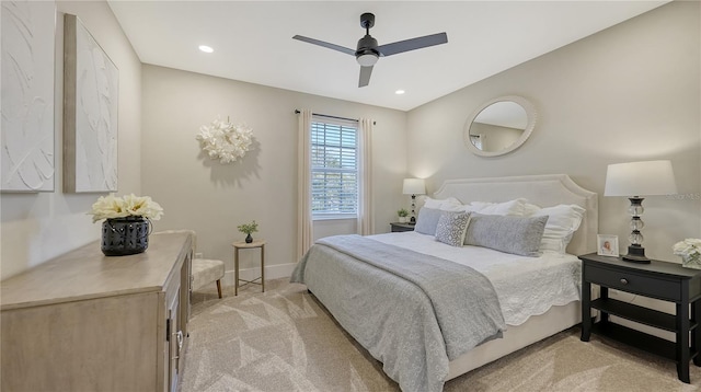 bedroom with recessed lighting, ceiling fan, baseboards, and light colored carpet