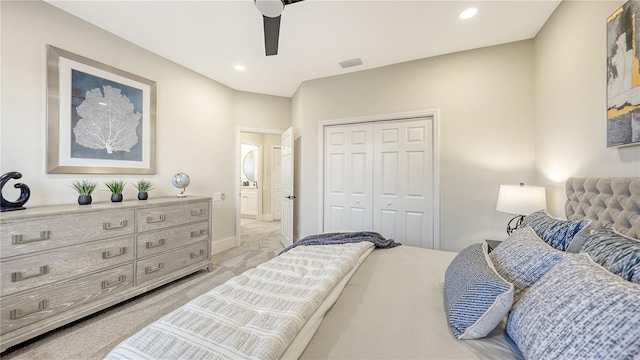 bedroom featuring light carpet, a closet, visible vents, and recessed lighting