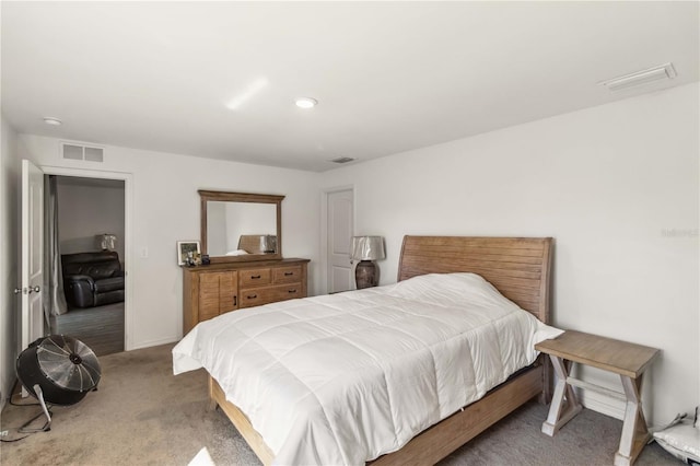 bedroom with carpet, visible vents, and baseboards