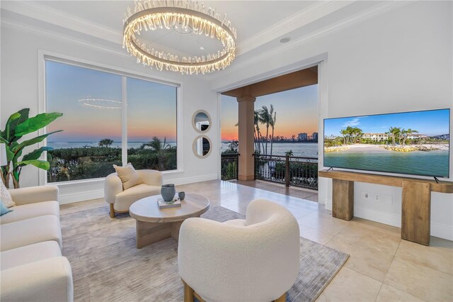3935 N Shell Rd, Sarasota, FL 34242 - tiled living area featuring crown molding, decorative columns, and a chandelier