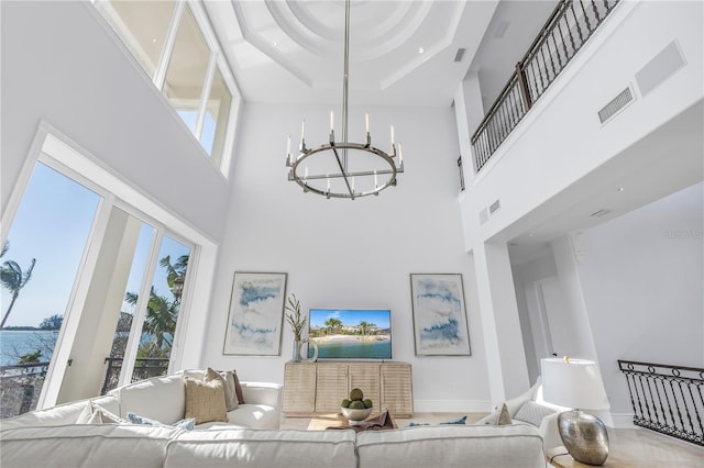 3935 N Shell Rd, Sarasota, FL 34242 - living room with a chandelier, a towering ceiling, and a tray ceiling