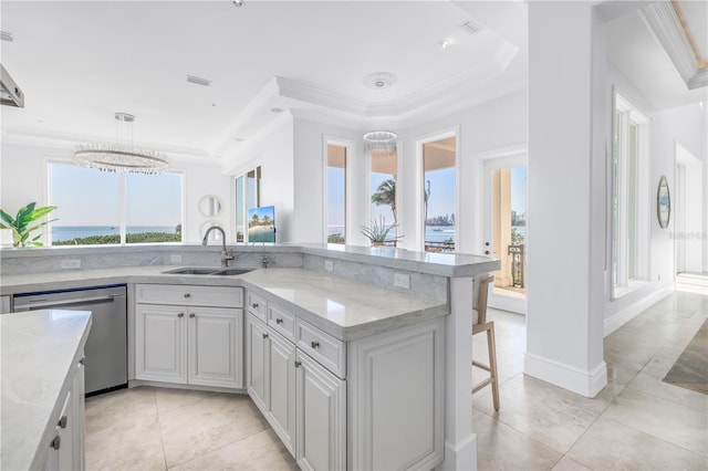 3935 N Shell Rd, Sarasota, FL 34242 - kitchen featuring dishwasher, ornamental molding, a chandelier, a breakfast bar, and a raised ceiling