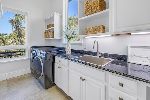 3935 N Shell Rd, Sarasota, FL 34242 - laundry room with cabinet space, washer and clothes dryer, and plenty of natural light