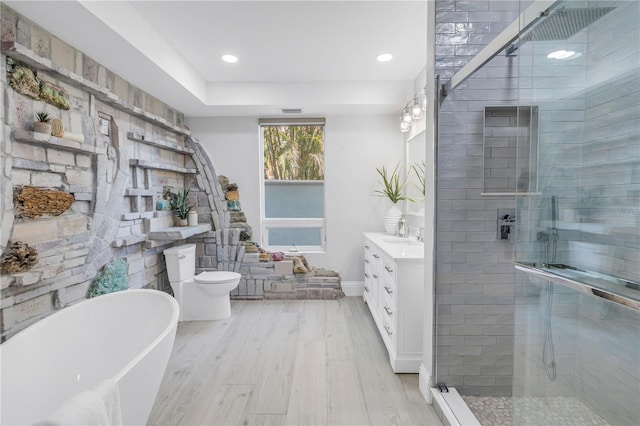 3935 N Shell Rd, Sarasota, FL 34242 - full bath featuring vanity, wood finished floors, a stall shower, a freestanding tub, and recessed lighting