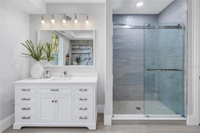 3935 N Shell Rd, Sarasota, FL 34242 - full bathroom with vanity, a shower stall, and wood finished floors