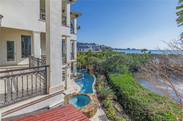 3935 N Shell Rd, Sarasota, FL 34242 - view of pool featuring a patio area, a water view, and a pool with connected hot tub