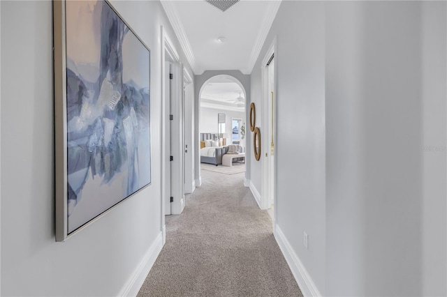 3935 N Shell Rd, Sarasota, FL 34242 - corridor with light carpet, crown molding, and arched walkways