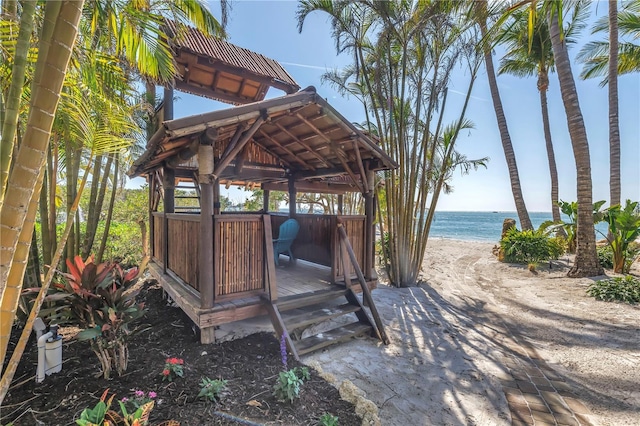 3935 N Shell Rd, Sarasota, FL 34242 - wooden terrace with view of water and beach and a gazebo