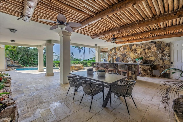 3935 N Shell Rd, Sarasota, FL 34242 - view of patio featuring a ceiling fan, outdoor dining space, and a pool with connected hot tub