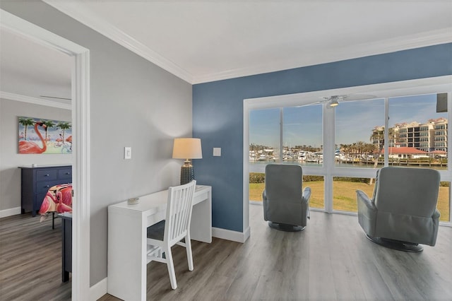 office space featuring ornamental molding, baseboards, and wood finished floors