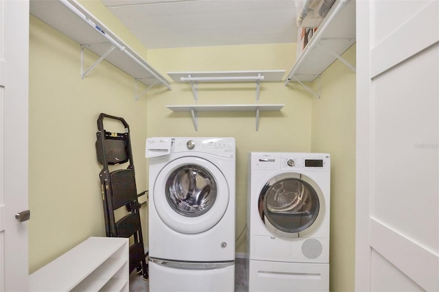 clothes washing area featuring laundry area and separate washer and dryer