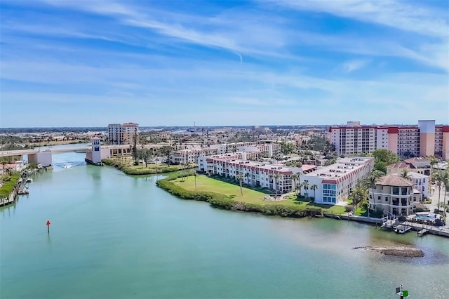 birds eye view of property featuring a view of city and a water view