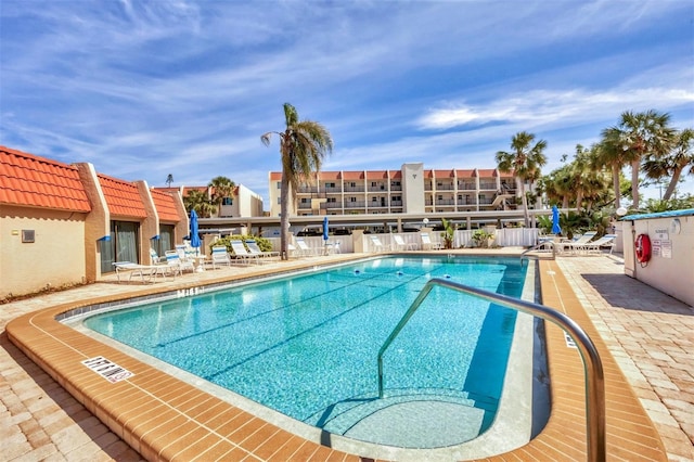 community pool featuring a patio area